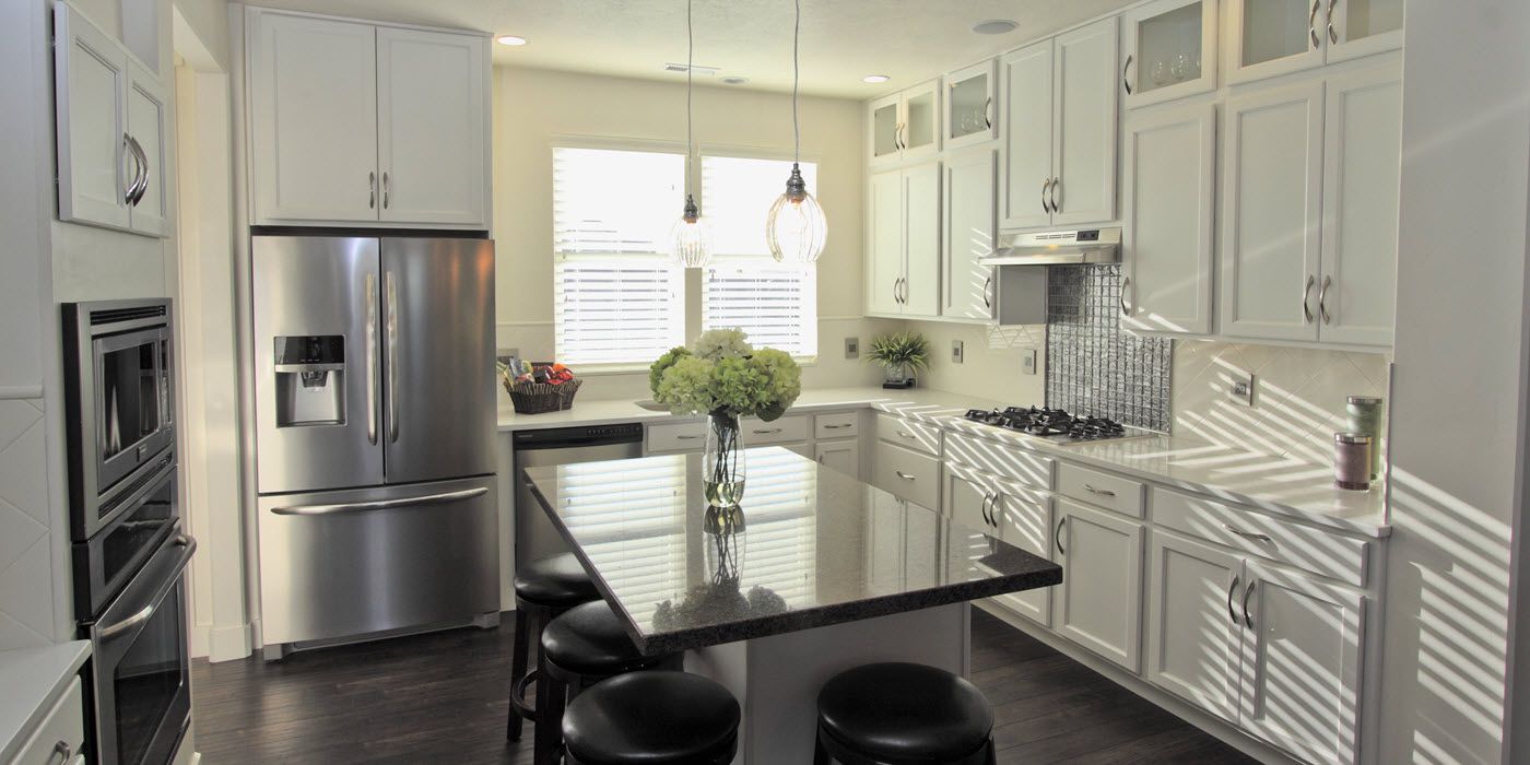 kitchen of model home in Daybreak with white cupboards
